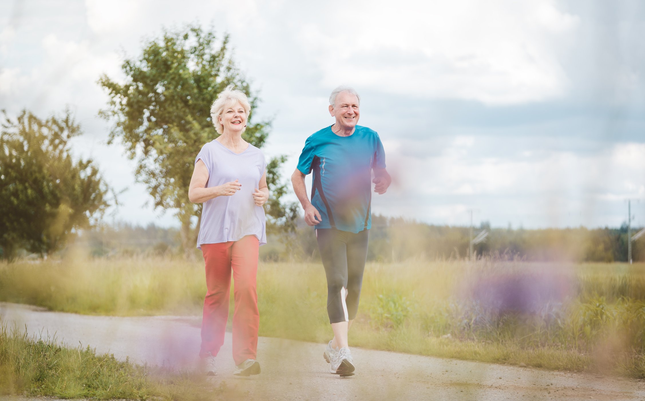  Senior Couple Running Outdoors